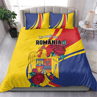Yellow and blue Romania bedding set with roses and eagle crest, two matching pillowcases.