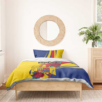 Yellow and blue Romania bedding set with roses and eagle crest, two matching pillows.