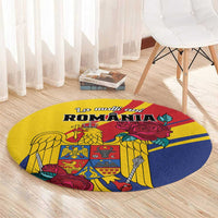 Round yellow carpet with Romania graphic, eagle and roses, centered on floor.