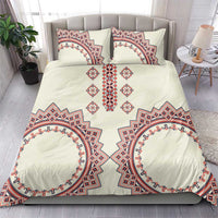 Beige duvet and two pillows with red and blue Romanian-style symmetrical pattern and central motifs