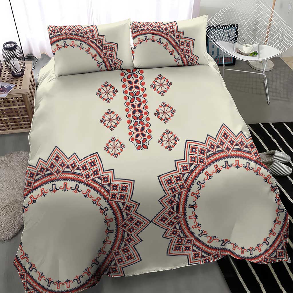 Beige bedding set with red and blue cross-and-diamond central design and large oval medallion prints