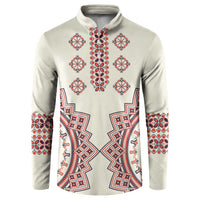 Beige button sweatshirt with red and blue folk embroidery panel and long sleeves