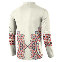 Beige button sweatshirt back view with red and blue folk embroidery across the yoke