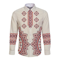 Beige long-sleeve button shirt with red, blue, and white folk embroidery front