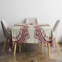 Beige tablecloth with bold red and blue diamond motifs on dining table