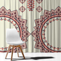 Beige curtains with bold red-and-blue circular designs and geometric border details