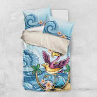 Blue tropical flamingo bedding set laid flat with two pillow cases and matching duvet