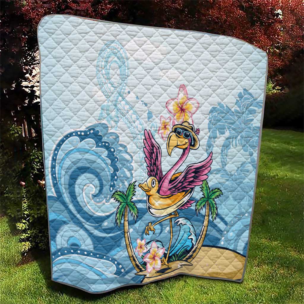 Blue tropical flamingo quilt close-up on outdoor lawn with wave and palm motifs