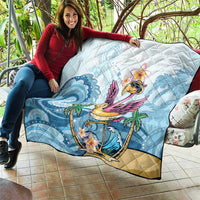Blue tropical flamingo quilt draped over sofa outdoors with palm and flower print