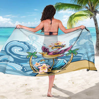 Blue flamingo sarong with plumeria flowers and ocean-wave pattern, side view