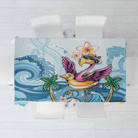 Blue tropical tablecloth with flamingo, plumeria flowers, and palm leaf pattern