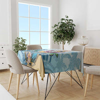 Blue tropical tablecloth on dining table with flamingo and palm leaf print