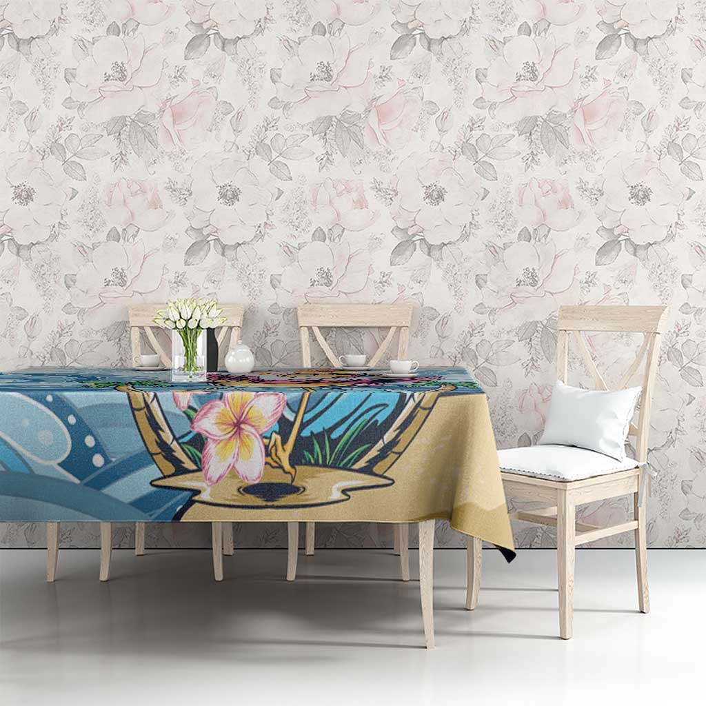Blue tropical tablecloth with flamingo and plumeria flower print on dining table