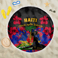 Round beach blanket with black background, red hibiscus, and Haiti festival design, fringe edge
