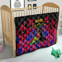 Black Haiti-themed quilt on baby bed/crib with red hibiscus flowers and Haiti emblem