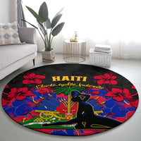 Black round carpet rug with gold Haiti lettering, red hibiscus corners, vivid blue scene