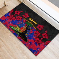 Black rubber doormat with Haiti lettering, red hibiscus and blue floral scene