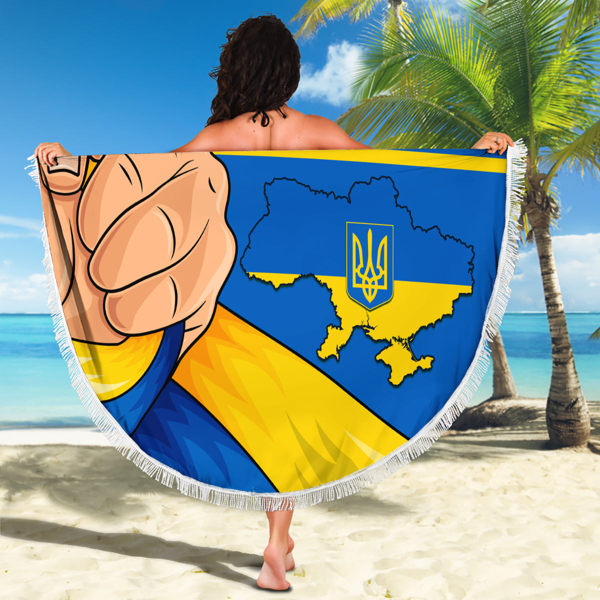 Round beach blanket with Ukraine flag graphic, comic fist and trident, held on sandy beach