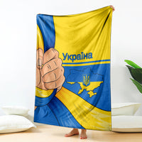 Printed blanket with Ukrainian flag colors, fist graphic, and Ukraine map