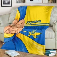 Ukrainian unity blanket with blue and yellow graphic print