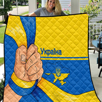 Quilted throw blanket with blue and yellow Ukraine flag design and peace-hand graphic