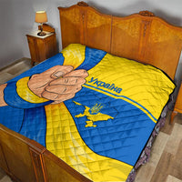 Quilted bedspread blanket in blue and yellow with Ukraine flag design and peace-hand