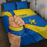 Blue and yellow Ukraine quilt bed set with large fist artwork and country map crest.