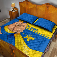Blue and yellow Ukraine quilt bed set with fist graphic, word 'Ukraine,' and crest on bedding.