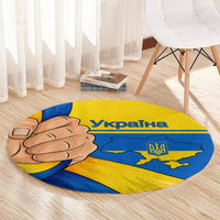 Round blue-and-yellow carpet with Ukraine lettering, trident emblem, and simplified map