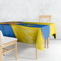 Ukraine Unity Day tablecloth draped on wooden dining table, blue and yellow design