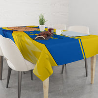 Ukraine Unity Day tablecloth on square table with plates, blue and yellow trident map