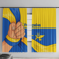 Window curtain panels in blue and yellow with trident emblem and Ukraine map graphic