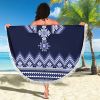 Navy blue round beach blanket with white folk motif and fringed edge