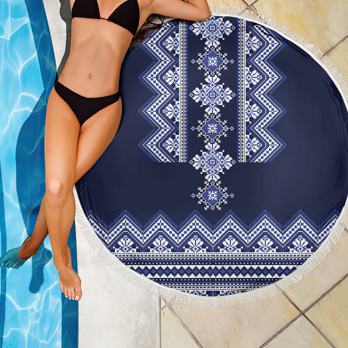 Navy blue round beach blanket with white folk center stripe and tassel fringe
