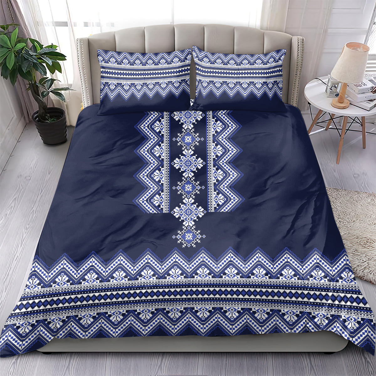 Navy blue duvet cover with white-blue folk trim pattern and two matching pillowcases