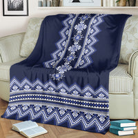 Ukrainian folk pattern blanket on sofa, dark navy with central diamond medallion