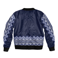 Navy blue bomber jacket with white-blue folk stripe pattern on back, ribbed hem and cuffs