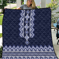 Navy blue quilt with white-blue folk geometric panel and zigzag border stripes