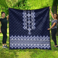 Navy blue quilt featuring a central embroidered-style geometric motif and border trim