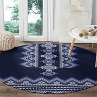 Round navy blue rug with folk diamond medallion and blue-and-white zigzag border