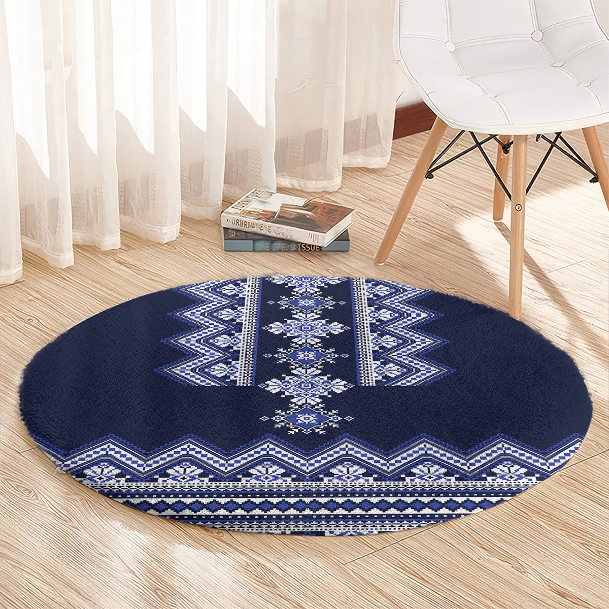 Round navy blue rug with white cross motif and chevron border, circular shape