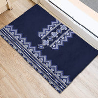 Navy blue rubber doormat with bold white chevron band and folk motif