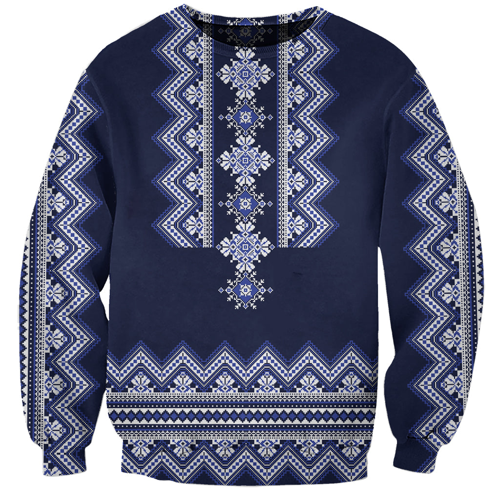 Navy crewneck sweatshirt with white-blue folk pattern across front, long sleeves