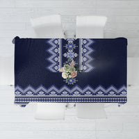 Navy blue folk patterned tablecloth with blue-and-white geometric border and center motif