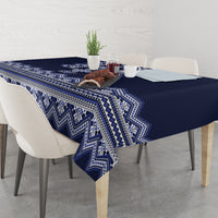 Navy blue tablecloth with blue-and-white folk stripe and chevron pattern, corner drop