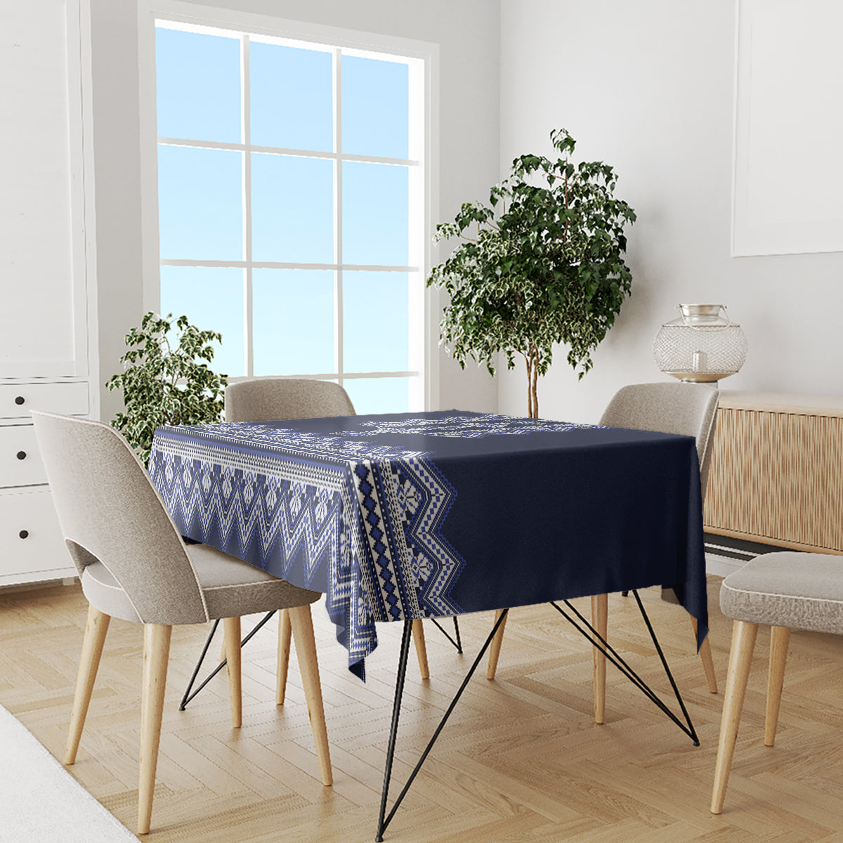 Navy blue tablecloth with blue-and-white folk geometric pattern on dining set
