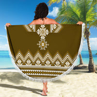 Brown round beach blanket with white folk medallion and zigzag border, tassel fringe