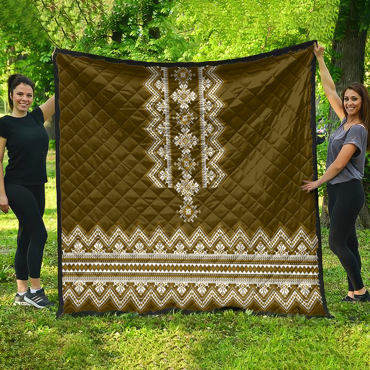 Brown quilt with large centered white folk stripe and zigzag border