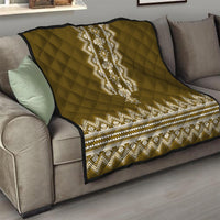 Brown quilt throw with diamond quilting and white folk stripe across the center
