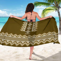 Brown folk-pattern sarong with centered diamond medallion and zigzag trim, back view